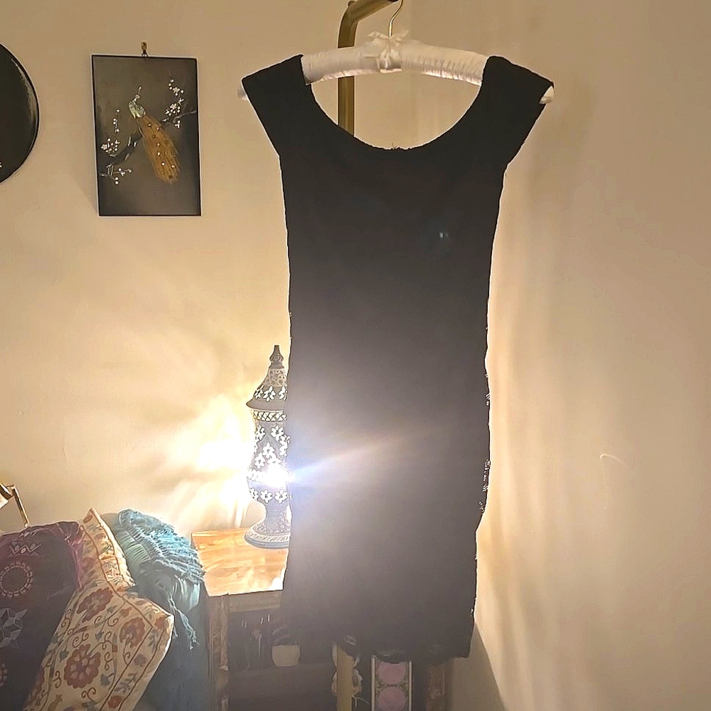 Lacy black body-hugging mini dress